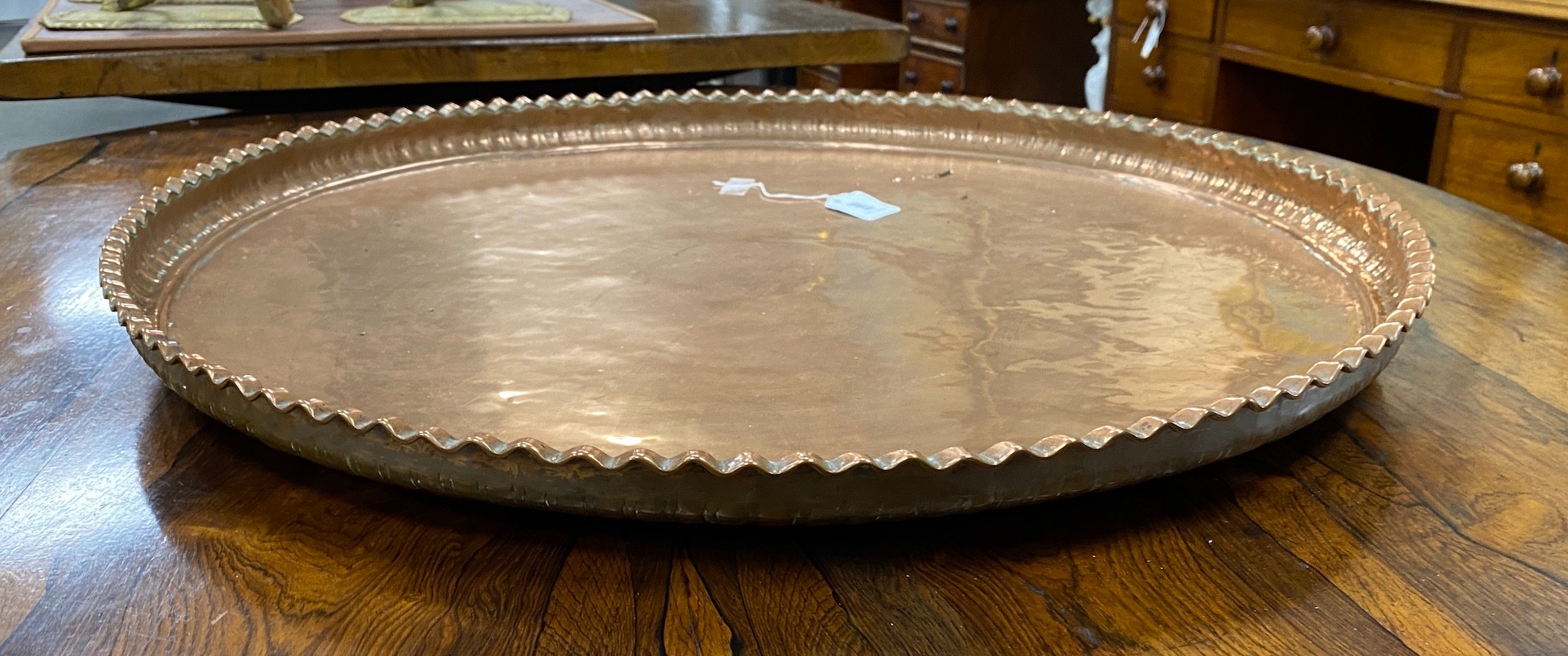 A large circular copper tray, diameter 74cm